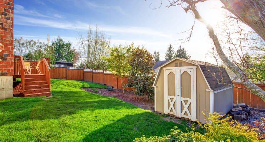 Fenced backyard with storage shed in Concord